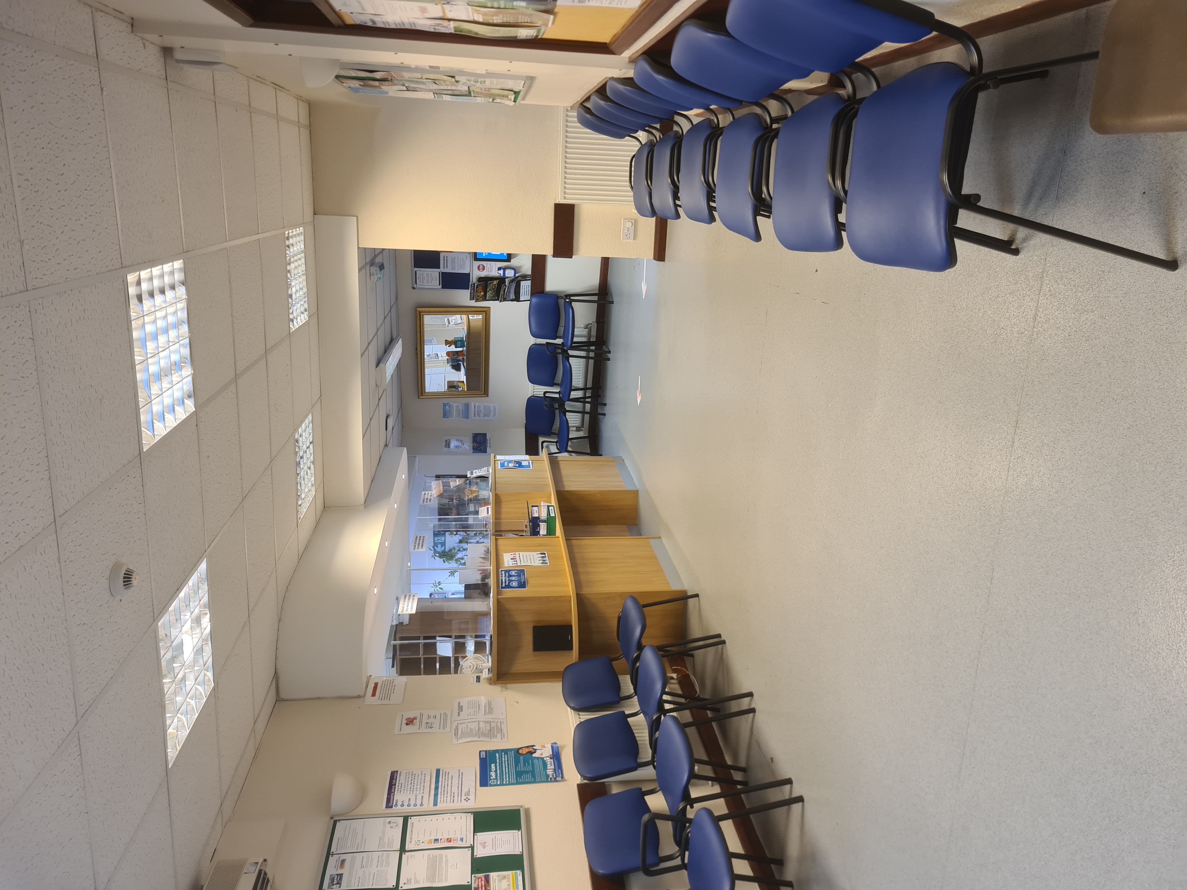 chairs lined up on either side of the waiting area